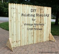 a wooden display for vintage markets and craft shows with the words diy folding display for vintage markets and craft shows