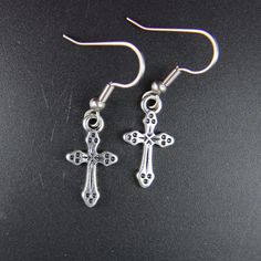 ♥ Cross Charm Earrings Cross Charm Cross Earrings Jesus Cross Charm Cross Gift Cross Pendant Coworker Gift Personalized Gift ♥ This is the beautiful Cross charm with a stainless steel ear hook ♥ You will receive 1 pair ♥ Alloy Cross charm 19x10.5x2 mm *earrings weight about 0.7 oz.* ♥ Hook Stainless steel 19 mm ♥ We strive for next day shipping, but we do not ship on Saturdays, Sundays, and Holidays. It may sometimes take a bit longer when we have unusually large volume of orders. Thank you for Nickel-free Cross Earrings As Gift, Gothic Cross Pierced Jewelry, Cross Earrings Vintage, Cross-shaped Jewelry With Matching Earrings, Nickel-free Cross Earrings For Gift, Grunge Cross Earrings, Silver Cross-shaped Stainless Steel Earrings, Earrings Cross, Horn Bracelet