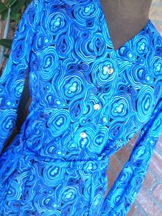 "Gorgeous vintage pre-loved dress from the 60's Bright colors on several blue tone, turquoise, celeste, skyblue Golden buttons with KS logo, long sleeves with 1 golden button, skinny belt made with the same fabric. Great vintage condition, no visible defects, pre-loved MATERIAL label says Ban-Lon (an hight quality nylon, silk touch) BRAND Ken Scott SIZE small/ M Vintage 10 (please refers on measures above) Approx measures taken flat shoulder cm 36 chest cm 43 Waist line cm 42 Hipsline cm 49 hem Ken Scott, Silk Touch, Bleu Turquoise, Taupe Color, Blue Tones, Blue Print, Vintage Dress, Dress Clothes For Women, Shades Of Blue