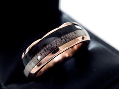 two tone gold and black ceramic wedding ring with an antler inlay on top