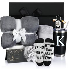 the baby gift box includes socks, booties and blanket