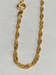 Hi Everyone on Etsy! This listing is for 1 strand of chain only. 24K Gold Filled Item Details: Lead and Nickel Free Clasp : Double Hooks Chain Style : Spiral Chain/ Singapore Chain. Length : 20Inches Thickness: 0.6mm on Chain x 2.5mm width This is a very simple charming chain, a fine chain and perfect for that minimalist look Please avoid chemical solutions, perfumes, excessive sweat, ocean water and swimming water. Salt water and chlorine can damage your jewelry. Chlorine can damage and discolo Gold Rope Chain Bracelet As A Gift, Gold Plated Spiral Jewelry, Gold Spiral Necklaces For Jewelry Making, Chain Layering, Star Charm Necklace, Excessive Sweating, Ring Chain, Butterfly Bracelet, Ocean Water