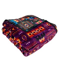 two blankets are stacked on top of each other, one is purple and the other is orange