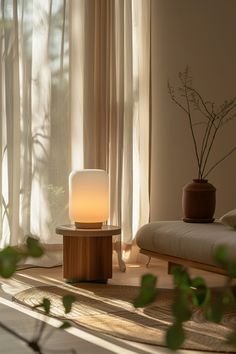 a lamp sitting on top of a wooden table next to a window covered in curtains