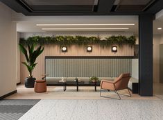 a living room filled with furniture and plants