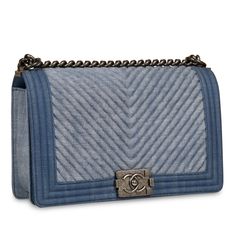 I mean, let’s be honest, the Chanel Boy in medium is really the only boy that’s worth your time… Am I right, ladies? Sleek, refined and effortlessly chic, the Boy embodies Chanel’s non-traditionally feminine aesthetic. Though yes, the Classic Flap will forever be the OG, the Boy bag remains one of the most iconic handbags of the past decade. Crafted from blue chevron denim and complimented by antique ruthenium-tone hardware, is there anything better than a match made in heaven?  A legendary piece designed by Karl Lagerfeld, the Boy will never go out of style and will remain a classic timepiece that you’ll wear and love forever. Large and spacious with an obviously stunning appearance, you can wear this bag with absolutely anything in your wardrobe. From casual jeans and a basic tee to a dr Chevron Purse, Chanel Denim, Blue Shoulder Bag, Dressy Skirts, Denim Handbags, Chevron Quilt, Blue Chevron, Navy Fabric, Feminine Aesthetic