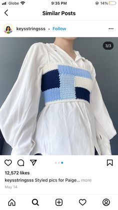 a white dress with blue stripes on the chest and sleeves is shown in an instagramtion