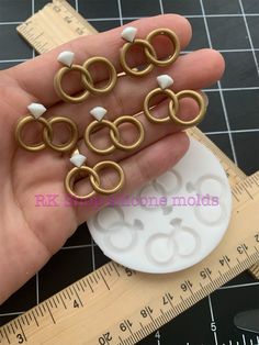 small gold plated metal rings on a scale