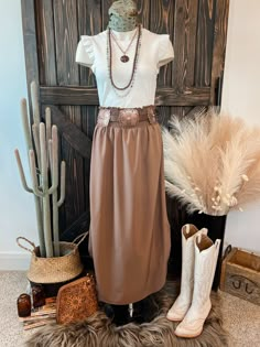 Ribbed knit tank top with ruffle detail. Perfect to wear as is with your favorite jewelry or wild rag. Or use it to layer with your favorite jackets, cardigans, and blazers. Material: 95% Cotton | 5% Spandex Small (2/4) | Medium (6/8) | Large (10/12) Brown Skirt White Boots, Cowgirl Professional Outfits, Western Maxi Skirt Outfit, Cowgirl Skirt Outfits, Western Church Outfits Women, Southern Chic Outfits, Western Professional Attire, Western Office Outfits, Western Skirt Outfits