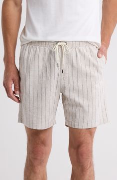 Lightweight cotton woven in pale stripes invites sunny-day comfort in shorts that tie at the waist and offer roomy pockets for holding essentials. 6" inseam; 22" leg opening; 11" front rise; 15" back rise (size Small) Elastic/drawstring waist Side-seam pockets; back flap-patch pocket 52% linen, 46% cotton, 2% elastane Machine wash, tumble dry Imported Relaxed Fit Striped Beachwear Shorts, Striped Relaxed Fit Shorts For Beachwear, Striped Linen Shorts For Summer, Striped Linen Summer Shorts, Cotton Relaxed Fit Shorts With Vertical Stripes, Relaxed Fit Bottoms With Vertical Stripes For Summer, Striped Cotton Bottoms For Summer, Summer Linen Bottoms With Vertical Stripes, Striped Linen Short Bottoms