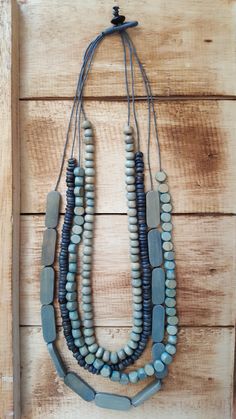 Cascading strands of glass, wood, and resin-cast beads with a slide system that adjusts from approximately 14-18 inches hanging length. You will LOVE the layered design of this handcrafted multi-strand necklace, it never disappoints. Go ahead, grab a few and wear them with everything! You’ll be glad you did. Jewelry Hacks, Upcycled Vintage Jewelry, Beads Craft Jewelry, Beaded Jewlery, Beaded Necklace Diy, Necklace Ideas, Wood Bead Necklace, Handmade Beaded Necklaces, Beading Ideas