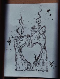 a piece of paper with a drawing of a candle and heart in the middle on it