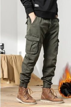 Introducing our newest addition to our men's clothing collection - the 2022 Multi-Pockets Winter Cargo Pants! These pants are perfect for those looking for a combination of style and functionality. With its slim fit design, it is sure to accentuate your figure whilst providing ample warmth during the winter season. Featuring multiple pockets, you can now carry all your essentials without compromising on style. Made of high-quality fleece fabric, these pants will keep you warm and cozy, making it perfect for outdoor activities. Available in black, it will easily match with any outfit, making it a versatile addition to your wardrobe. Get yours now and elevate your winter wardrobe game. Cargo Pants Matching Outfit, Mens Clothing Styles Cargo Pants, Winter Pants For Men, Cargo Pants Outfit Men Winter, Men’s Cargo Pants Styles, Men’s Pants, Cargo Pants Men Outfit, Wicked Accessories, Cargo Joggers Outfits