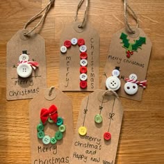 four christmas gift tags with buttons attached to them