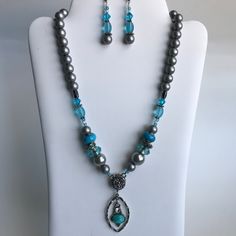 Beautiful and unique blue and gray glass necklace with matching earrings. Only 1 made.  Free gift box and ribbon included,  plus free shipping in the USA. Blue Beaded Jewelry Sets For Gift, Blue Jewelry Sets With Round Beads As A Gift, Gray Beaded Necklace As Gift, Gray Beaded Necklace For Gift, Blue Czech Glass Jewelry For Gifts, Blue Costume Jewelry Sets For Gifts, Grey Glass, Beaded Necklaces, Hippie Bohemian