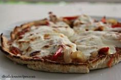 a pizza sitting on top of a pan covered in cheese