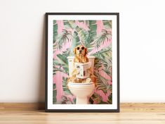 a dog sitting on top of a toilet in front of a wall with palm leaves