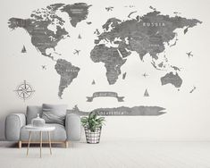 a living room with a couch, chair and large wall map on it's side