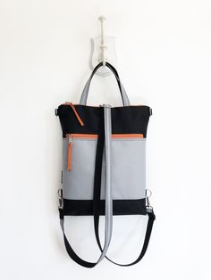 "Convertible customizable water resistant minimal slim fit backpack DETAILS - outer zippered pocket front and back - 4 inside open pockets - inside zipper pocket - zipper closure - metal parts nickel - double hand strap: optional (20\" long on the pictures) MATERIALS and other customization - in the pictures: light grey with back and orange zipper, nickel metal parts - outer: optional WATERPROOF CORDURA fabric (100%PES) - internal: beige canvas - optional metal hardwer - optional zipper colors T Modern Rectangular Backpack With Ykk Zipper, Hipster Backpack, Sustainable Backpack, Modern Backpack, Chic Backpack, Waterproof Laptop Backpack, Unique Backpacks, Vegan Leather Backpack, Stroller Bag