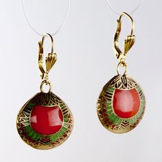 This over 3000 year old design is work of timeless elegance. An exact replica of an ancient Egyptian design from the Egyptian Museum of Cairo, these enamel on copper cloisonné earrings depict abstracted scarabs in a beautifully detailed geometric design. Silver lever- backs ear wires for pierced ears. Size 1 1/2 Inches tall. Traditional Red Enamel Jewelry, Traditional Red Brass Earrings, Artisan Red Jewelry With Artistic Design, Artistic Metal Drop Earrings, Red Enamel Traditional Earrings, Artisan Enamel Drop Earrings Jewelry, Traditional Red Enamel Earrings, Artisan Enamel Jewelry With Ear Wire, Traditional Red Oval Earrings