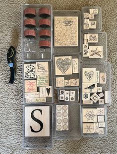 several stamps and some scissors on the floor