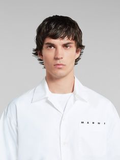 Short-sleeved bowling shirt made from organic cotton poplin. Detailed with a Marni logo poking out from behind the chest pocket. Boxy fit with straight-cut hem and mother-of-pearl button closure. Can be worn with a bowling collar or fully buttoned up. Marni Shirt Outfit, White Relaxed Fit Poplin Shirt, Marni Shirt, Flat Heel Boots, Trunk Bag, Bowling Shirts, Lacing Sneakers, Boot Accessories, Women Essentials