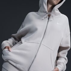 Find NIKE Sportswear Phoenix Fleece Oversized Full-zip Hoodie on Editorialist. Grounded in style, comfort and versatility, meet our take on luxury loungewear. This zip-up hoodie helps you stay cozy all day long, thanks to midweight fleece that feels soft yet structured. Plus, exaggerated details (like the oversized pocket and taller ribbing) give you a trend-right look. Benefits:Our midweight brushed fleece feels extra soft on the inside and smooth on the outside, helping you stay cozy while kee Nike Activewear With Drawstring Hood For Gym, Nike Activewear With Drawstring Hood For Streetwear, Comfy Sports Hoodie Activewear, Comfy Sports Activewear Hoodie, Comfy Hooded Activewear For Sports, Athleisure Fleece Hooded Jacket With Ribbed Cuffs, Fleece Hooded Jacket With Ribbed Cuffs For Athleisure, Nike Athleisure Track Jacket, Nike Athleisure Activewear With Drawstring Hood