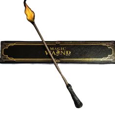 a harry potter wand with the words'magic wandd'written on it and an orange flame