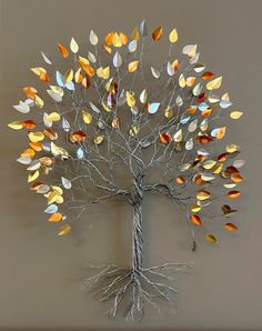 a metal tree with many leaves on it