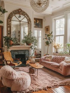 a living room filled with furniture and a fire place next to a mirror on the wall