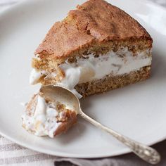 a piece of cake on a plate with a spoon