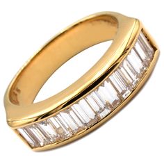 Gilberto Cassola 18Kt Yellow Gold Ring with Baguette Diamonds. Handmade in Italy in Our Athelier in Valenza (AL). 18Kt Gold g 8,20 F Color VVS Clarity Baguette Diamonds Total Weight ct 1.35 This Ring is a Regular Size 53 (EU) and can be delivered in any Size with no Additional Cost. A very Classy and Timeless Piece, Handcrafted with the Highest Italian Quality. Classic Gold Baguette Diamond Ring, Classic Gold Baguette Ring, Gold Baguette Rings For Formal Occasions, Formal Baguette Channel Set Rings, Timeless Gold Baguette Diamond Ring, Formal Baguette Ring With Brilliant Cut, Gold Baguette Diamond Ring For Formal Occasions, Formal Gold Baguette Diamond Ring, Luxury Baguette Ring For Formal Occasions