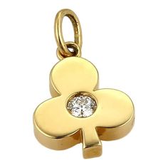 This elegant authentic charm is by Hearts on Fire. It is crafted from solid 18k yellow gold with a polished finish and is in the Club of House charm with a round cut diamond in the center. It is fully signed with the metal content.  Hallmarks: HOF 750  Material: 18k yellow gold  Measurement: 16.1mm long x 9.7mm wide  Genuine diamond  Weight: 2.2 grams Luxury Yellow Gold Pendant Charms, Luxury Yellow Gold Charms For Anniversary, Elegant Gold Charms For Formal Occasions, Luxury Gold Charms For Anniversary, Elegant 14k Yellow Gold Charms, Yellow Gold Diamond Charms As Gift, Luxury 14k Yellow Gold Charms, Classic Yellow Gold Charms For Gifts, Classic Yellow Gold Charms For Gift