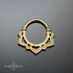 an image of a gold nose ring