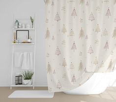 a bathroom with a shower curtain that has christmas trees on it and white shelving