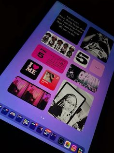 an ipad with many different stickers on the screen and it's display lit up