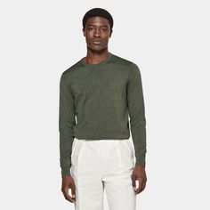 A simple luxury layer in a rich all-season shade, this dark green crewneck sweater is made for effortless luxurious layering. Green Crew Neck Sweater For Layering, Green Sweater With Ribbed Cuffs For Work, Olive Crew Neck Sweater For Fall, Olive Long Sleeve Sweater For Layering, Classic Green Workwear Sweater, Green Crew Neck Sweater For Workwear, Green Tops For Business Casual In Fall, Green Business Casual Tops For Fall, Dark Green Crewneck