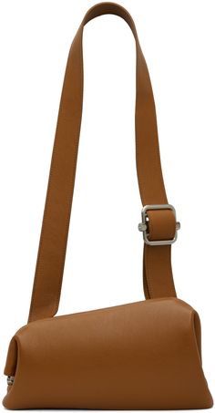 Asymmetrical grained leather shoulder bag in tan. · Adjustable shoulder strap · Silver-tone logo stamp at back face · Hinged closure · Patch pocket at interior · Cotton canvas lining · H6.5 x W11 x D3 Supplier color: Tan brown Modern Cognac Saddle Bag With Detachable Strap, Modern Brown Flap Bag With Adjustable Strap, Modern Brown Satchel With Adjustable Strap, Modern Brown Saddle Bag With Detachable Strap, Cognac Textured Leather Shoulder Bag For Office, Modern Brown Crossbody Saddle Bag, Modern Brown Saddle Bag For Daily Use, Modern Brown Flap Bag For Everyday, Modern Everyday Brown Flap Bag