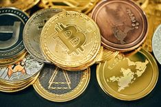 several different types of bitcoins sitting next to each other