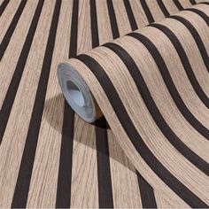 black and white striped wallpaper with wood grains on the bottom right hand side