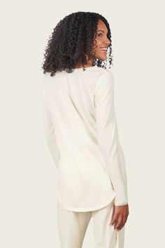 Delicate trim on the neckline and sleeves, balanced with the loose flow of this classic long sleeve t-shirt will make it a cozy favorite any time of year. Mix and match this classic T with any of our bamboo bottoms for a snuggly duo of comfort at home. Throw it over jeans for casual weekend wear or wear it as a base layer under winter sweaters. Generous and loose-fit design. If in doubt, size down. See sizing guide at left. A classic long sleeve t-shirt with a scoop-neck design Perfect oversized Bamboo Pajamas, Comfortable Pajamas, Lounge Dress, Casual Weekend, Fine Yarn, Weekend Wear, Pajama Shirt, Pajama Top, Womens Loungewear