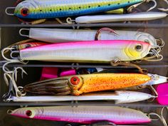 several different types of fishing lures on display