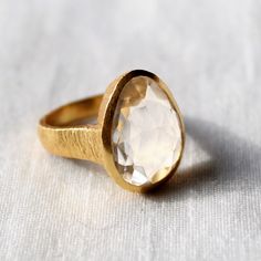 D E T A I L S - Material: 925 Sterling Silver Stone: Crystal The fit: True to US ring size Finish: Smooth and Gold Plated to a high shine S H I P P I N G & P R O D U C T I O N - My current production time is 2-6 business days, which means after those days are up, your order ships! I make everything custom to order, by hand, but I promise you it's worth the wait! R U S H - M Y - O R D E R - If you're in a rush to get your pretty new pieces, please send me a message and I'll let you know just Timeless Teardrop Ring As A Gift, Timeless Faceted Rings As Gifts, Timeless Faceted Ring As A Gift, Timeless Sparkling Ring As A Gift, Gold Sterling Silver Moonstone Ring, Moonstone Ring With Bezel Setting For Anniversary, Bezel-set Moonstone Ring For Anniversary, Bezel Set Moonstone Ring For Anniversary, Clear Quartz Ring