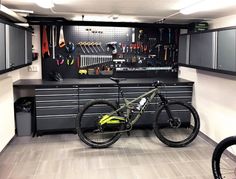 a bike is sitting in the middle of a garage