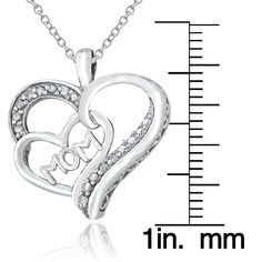 This lovely heart pendant showcases a polished MOM heart in the center of a larger diamond studded heart. The pendant includes an 18-inch rolo chain which is secured by a spring ring clasp. The necklace is crafted of sterling silver and the total diamond weight is .13 carat. Product Details Metal Type sterling-silver Metal Stamp 925-sterling Weight 3.2GR Length 18IN Width 21.65MM Height 23.5MM Clasp Type spring-ring Chain Type rolo Chain Length 18 Stone Details Gem Type diamond Number of Stones Mother's Day Cubic Zirconia Pendant Jewelry, Mother's Day Anniversary Jewelry With Diamond Accents, Diamond Accented Jewelry For Anniversary On Mother's Day, Silver Heart Pendant With Diamond Accents, Silver Diamond Pendant Necklace For Valentine's Day, Silver Jewelry With Diamond Accents For Valentine's Day, Silver Charm Necklaces For Mother's Day, Silver Pendant Charm Necklace With Diamond Accents, Personalized Silver Diamond Necklace With Cubic Zirconia