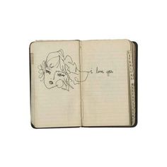 an open notebook with a drawing of a woman's face on the page and writing