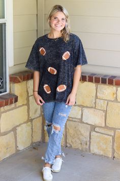 Short sleeve washed sparkly football graphic.McKenna is wearing a size Medium Full length teelight weightblack washed colorRuns true to sizeHEY BABE! WE ONLY OFFER STORE CREDIT FOR RETURNS! Feel free to email us or DM us on Instagram with any questions regarding fit or sizing or our return policy in general. Sequin Football Shirt, Sporty Black Washed T-shirt, Sporty Black Washed Top, Black T-shirt For Game Day In Fall, Black T-shirt For Fall Game Day, Black Tops For Game Day During Football Season, Black Relaxed Fit T-shirt For Game Day, Casual Crew Neck Tops For Tailgating, Sporty Graphic Print Top For Tailgating