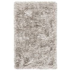 a shaggy rug on a white background with no one in the room to see it