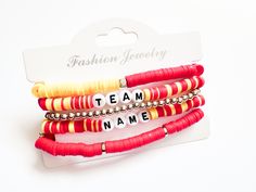 A Chiefs bracelet stack of 5 bracelets. The words Team and Name will be replaced.   Please note the mixed colors like red and yellow will be mixed in at random and may not be placed EXACTLY like this image as well as the gold pieces in the red bracelet.  Please choose bracelet size.  If you are looking for another team message me! Red Stacked Beaded Bracelets For Gifts, Red Stacked Beaded Bracelets As Gift, Adjustable Red Stacked Beaded Bracelets, Adjustable Stacked Red Beaded Bracelets, Red Adjustable Stacked Bracelets, Adjustable Stacked Red Bracelets, Trendy Red Stackable Beaded Bracelets, Red Trendy Stretch Bracelet With Letter Beads, Trendy Red Stretch Bracelet With Letter Beads