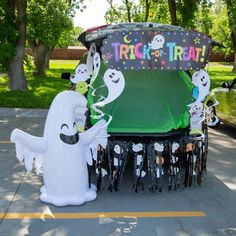 an inflatable trick - or - treat display with ghost characters